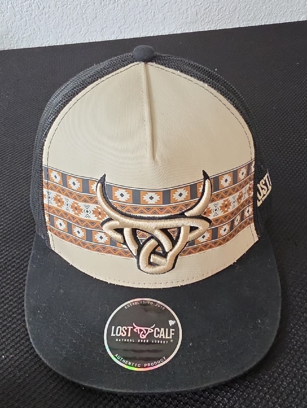 Men’s Beige and Black Trucker Hat with Western Knot Logo